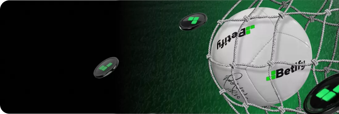 Betify ballon signé touchant le filet sur un terrain vibrant